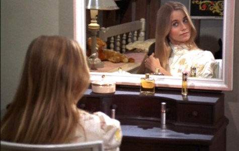 Marcia Brady brushing hair